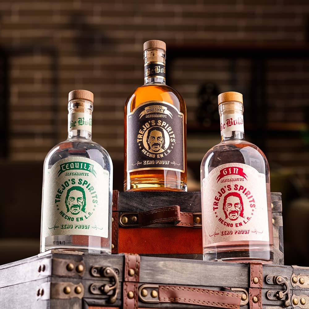 Tequila, American Whiskey and Gin Alternative bottles on a vintage trunk