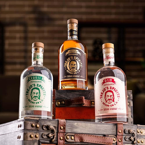 Tequila, American Whiskey and Gin Alternative bottles on a vintage trunk