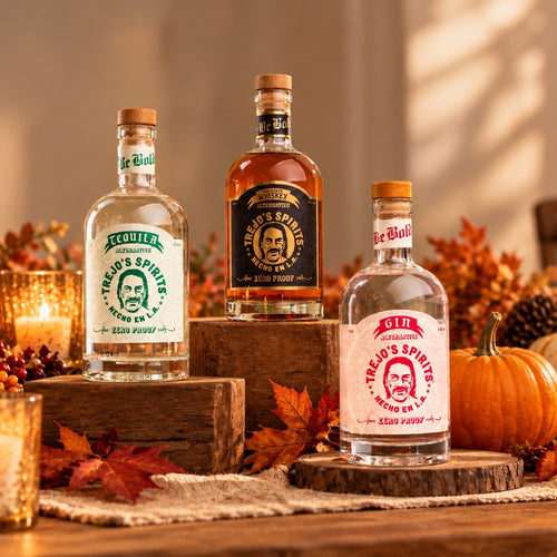 Trejo's Spirits Tequila, American Whiskey and Gin Alternatives on a fall table with pumpkins and candles